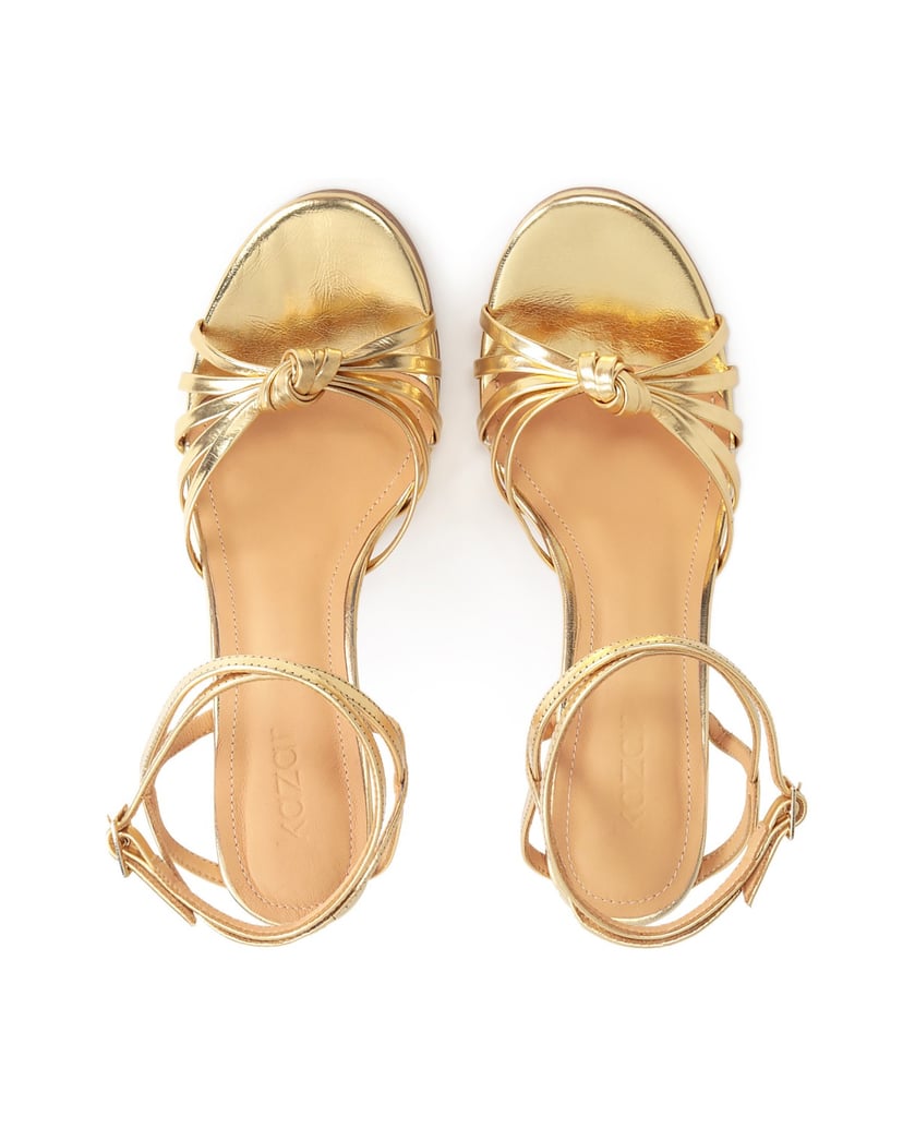 Kazar-Elegante-goldene-Sandalen-mit-schrägen-R-gold