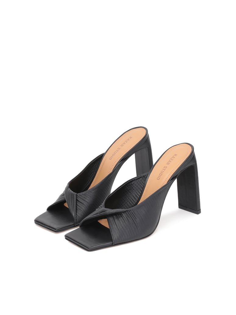 Kazar-Studio-Elegante-schwarze-Lederpantoletten-auf-e