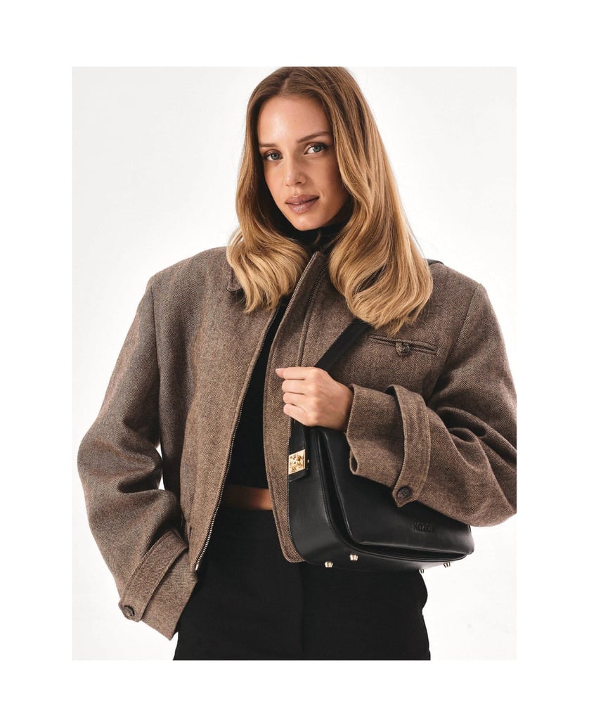 Kazar-Black-handbag-with-striking-pinned-strap-čierna