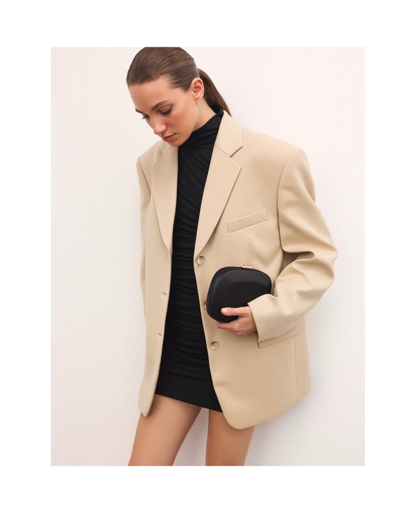 Kazar-Black-fabric-clutch-bag-with-rounded-shape-černá
