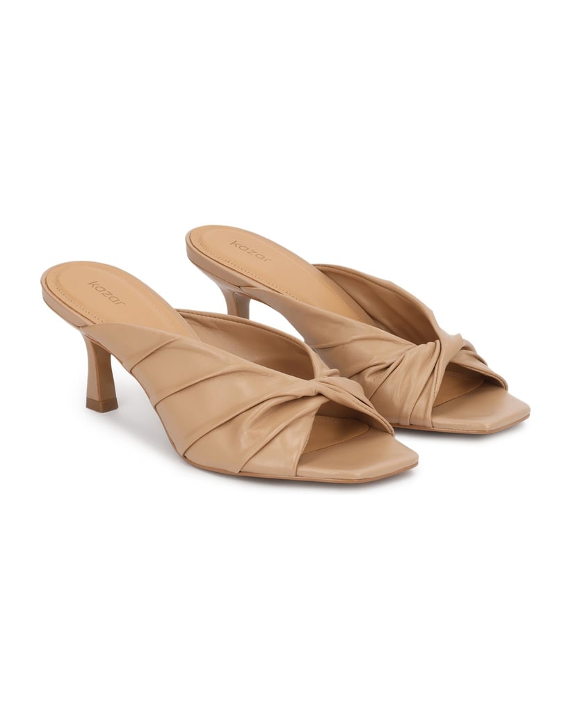 Kazar-Beige-leather-mules-with-an-eye-catching-crease-béžová