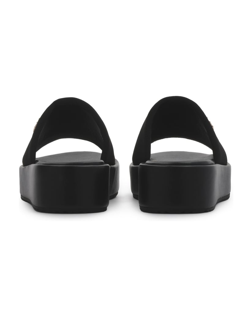 Kazar-Black-fabric-slides-on-a-thick-sole-with-a-gold-monogram-čierna