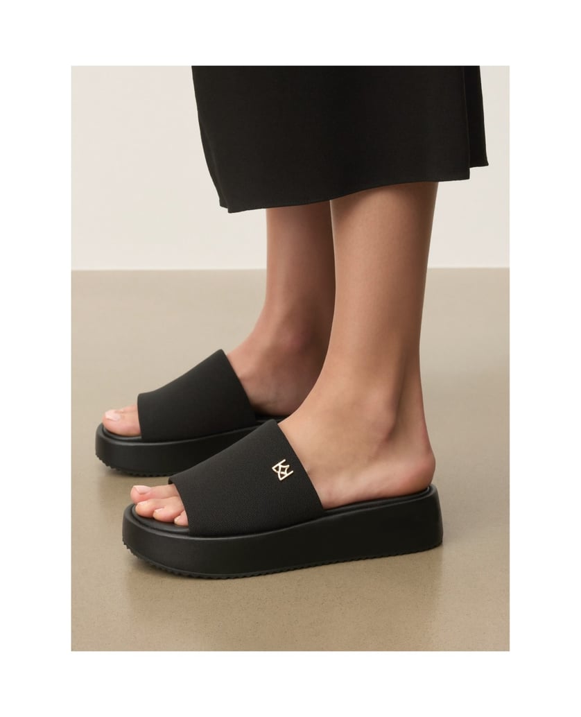 Kazar-Black-fabric-slides-on-a-thick-sole-with-a-gold-monogram-čierna