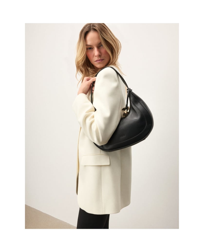 Kazar-Black-crescent-shaped-handbag-with-decorative-key-ring-černá