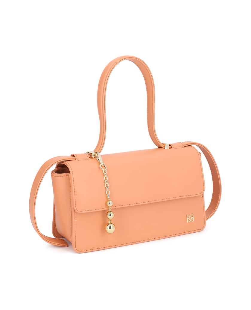 Kazar-Orange-oblong-bag-with-decorative-strap-and-keychains-oranžová