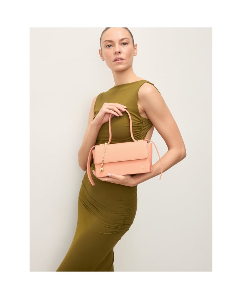 Kazar-Orange-oblong-bag-with-decorative-strap-and-keychains-oranžová